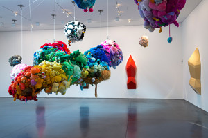Mike Kelley. Deodorized Central Mass with Satellites. 1991/1999. Plush toys sewn over wood and wire frames with styrofoam packing material, nylon rope, pulleys, steel hardware and hanging plates, fiberglass, car paint, and disinfectant. Overall dimensions variable. (c) Estate of Mike Kelley.  Images courtesy of Perry Rubenstein Gallery, Los Angeles. Photography: Joshua White/JWPictures.com.